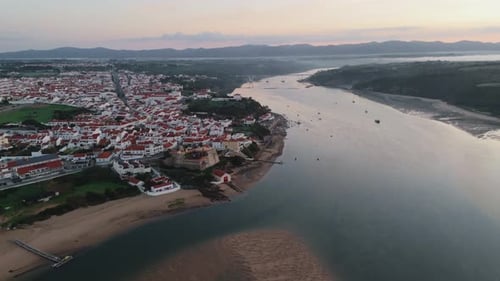 Aerial View Of Lisbon Town By The Riverbanks In Portugal.