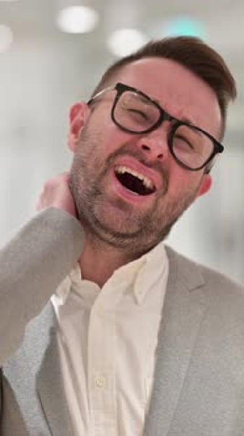 Stressed Creative Man having Neck Pain, vertical video