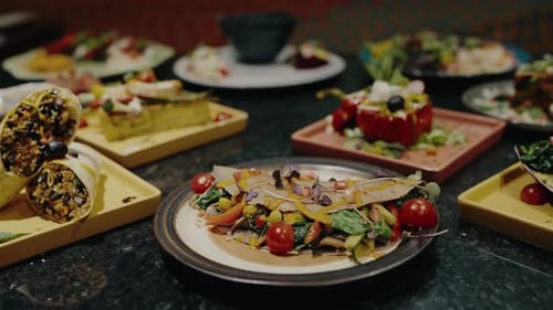 Different Dishes on Table in Vegetarian Restaurant