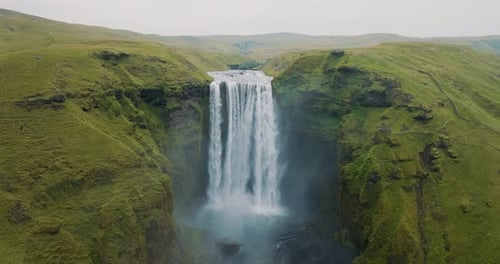 Aerial view of skogafoss waterfall and cliffs, Iceland.