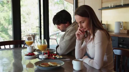 Couple Arguing over Breakfast in Sunny Home