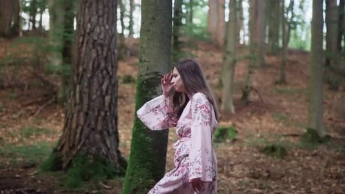 European Girl In Floral Dress Walking In The Mountain Forest. - side view, slow motion