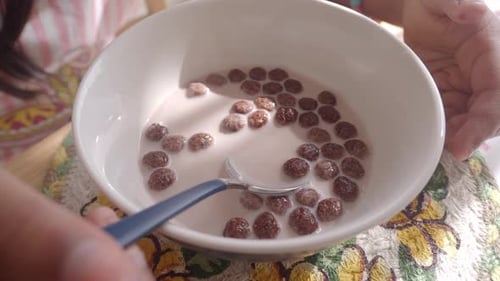 Chocolate Cereal Balls Mixed in Milk