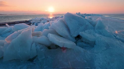 Arctic Winter Landscape of Broken Crystalline Ice Layers with Soft Sunset Tones