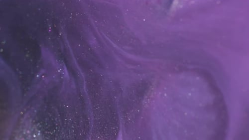Abstract Purple Glitter Particles Flowing Fluidly Background