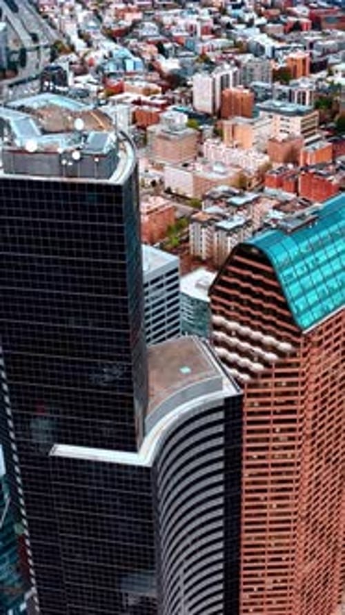 Aerial view skyscrapers Seattle city. American business district flight over. Vertical video