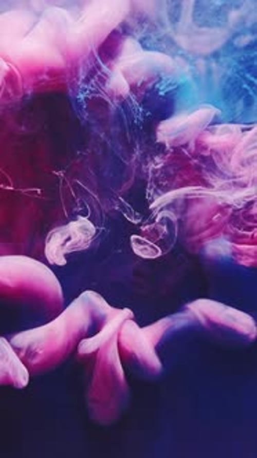 Pink and Blue Ink Swirling Abstractly