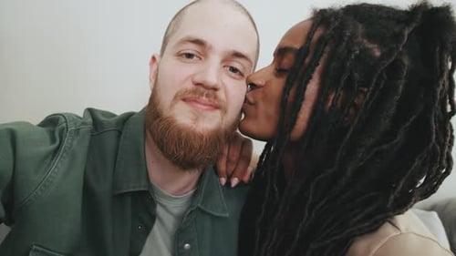 Happy Diverse Couple Posing for Selfie Indoors