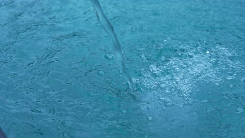Pouring Water Stream Filling Swimming Pool