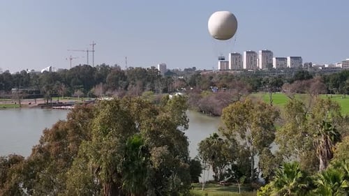 Aerial shot of a hot air balloon over Yarkon Park Tel Aviv, Israel