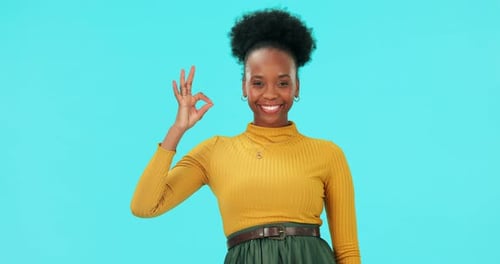 Okay hands, face and woman in studio for vote, good review and trust on blue background