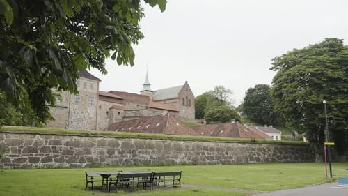 Stone Fortress Architecture with Red Roofs and Walls