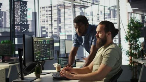 Team Leader Supervising IT Staff Member Optimizing Code