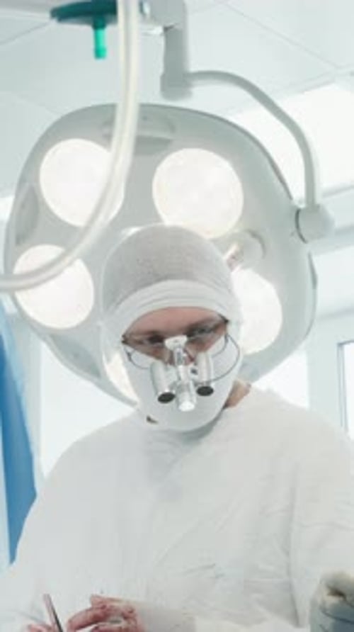 Surgical Team Operates Patient in Clinic