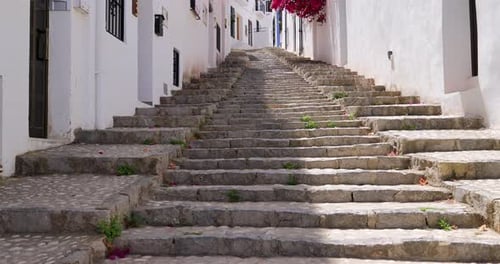 Footage of the beautiful city of Altea in Spain showing stairs going up with traditional Spanish
