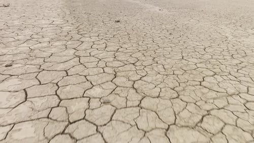 Aerial of the cracked surface of a dry lake