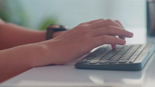 Hands of Coder Typing on Keyboard
