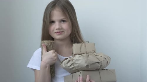 Girl with Wrapped Gifts and Twine