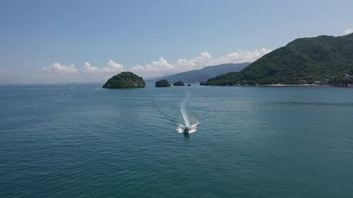 Motorboat Speeding Across the Blue Ocean