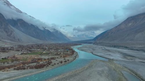 Drone shot of Gilgit landscape under clouds in Pakistan.