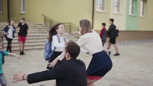 Children run for hugs at school