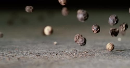 Peppercorns or black pepper spice. Super Macro Close Up. Shot on super slow motion camera 1000 fps.