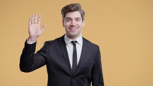 Friendly American Mature 30s Aged Businessman Waving Hand Hello Hi Salute Chao Greetings on Beige