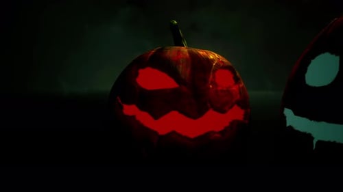 Close up of Scary Orange Glowing Jack o Lantern in Darkness