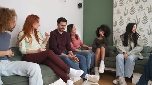 Group of friends talking on sectional sofa