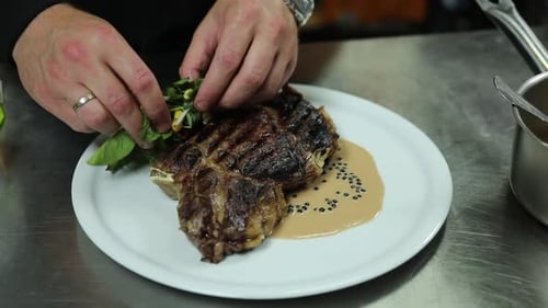 the chef prepares delicious meat in the restaurant