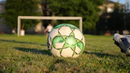 Male Foot of Professional Footballer Shooting a Penalty Kicks on Stadium at Sunset Leg of Sportsman