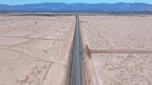 Endless Road to Horizon Through the Desert Valley Aerial View of a Desert