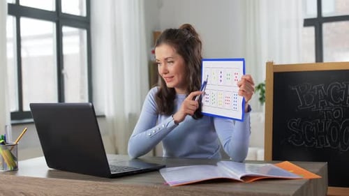 Enthusiastic Woman Teaching Online Math Lesson