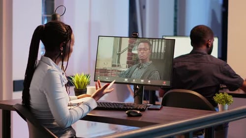 Office Worker Talking to Manager on Videocall Conference