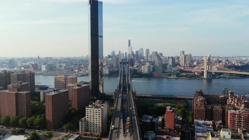 Aerial View of New York City's East River Featuring the Brooklyn Bridge Manhattan Bridge and The