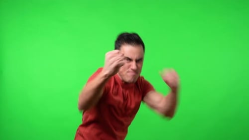 Man Fighting Aggressively on Green Screen