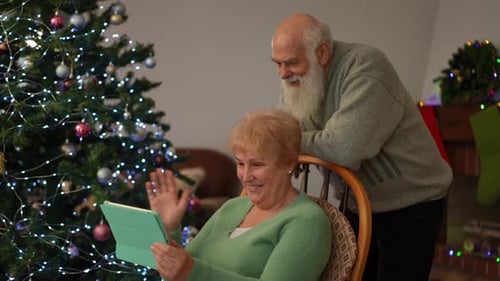 Seniors Video Call on Tablet at Christmas