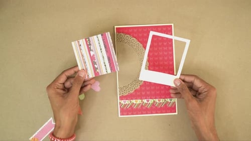 Hands Crafting a Handmade Greeting Card