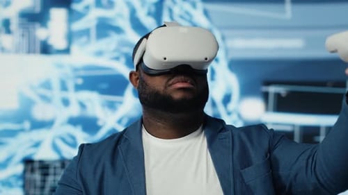 Black IT Specialist Works on Machine Learning with Virtual Reality Glasses