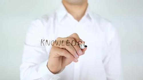 Man Writing Knowledge with Marker Close Up