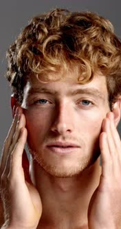 Beauty, face and laughing with man in studio for hygiene, masculine grooming or skincare wellness