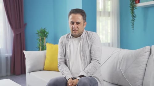 The man is disgusted.