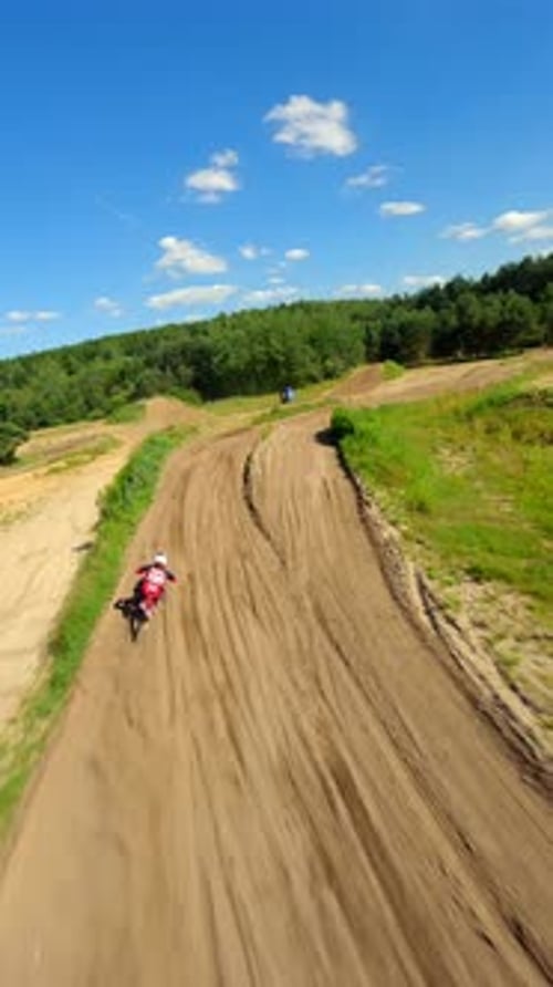 Dirt Bike Riding on Rural Motocross Track, Aerial View