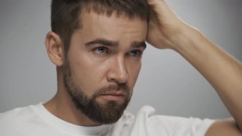 Bearded Man Combs Short Hair Style