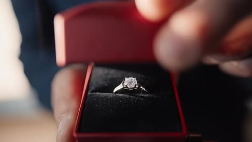 Opening Red Ring Box Revealing Diamond Engagement Ring