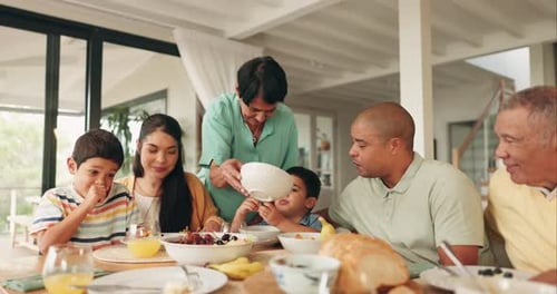 Family Meal Around Dining Table at Home