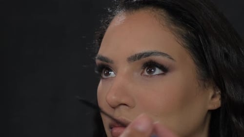 Woman Having Mascara Applied in Close-Up Shot