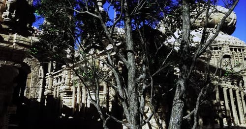 Ancient Temple Ruins Surrounded By Trees in Bright Sunlight