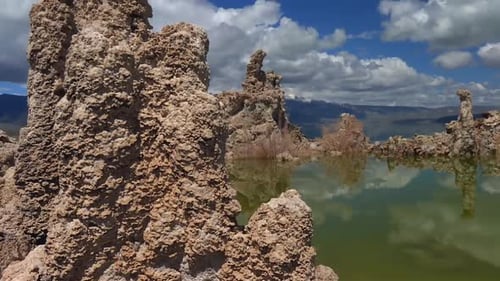 Tufa towers rising from Mono Lake, California, showcasing unique geological formations and a saline
