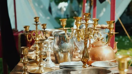 Antique Metal Objects Displayed Outdoors on Table